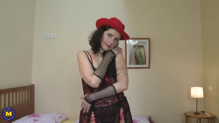 Lingerie clad mature brunette plays alone